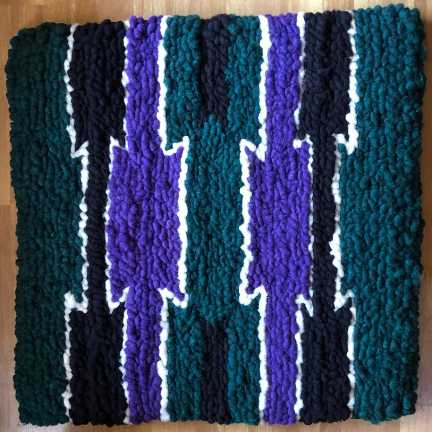 A mutli-colored saddle pad.